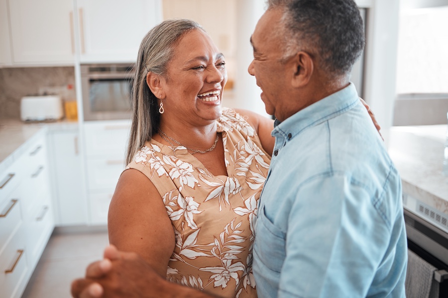 Senior couple dancing in the kitchen